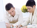 Business couple working Coaching is a profession of love. You can't coach people unless you love them. Eddie Robinson